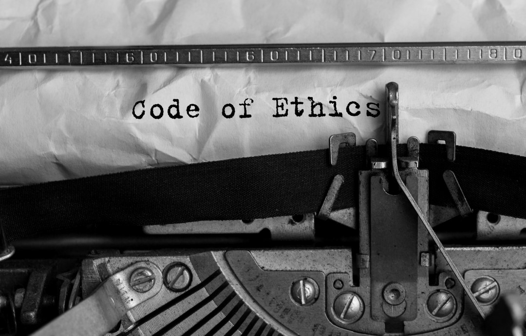 Text Code of Ethics typed on retro typewriter