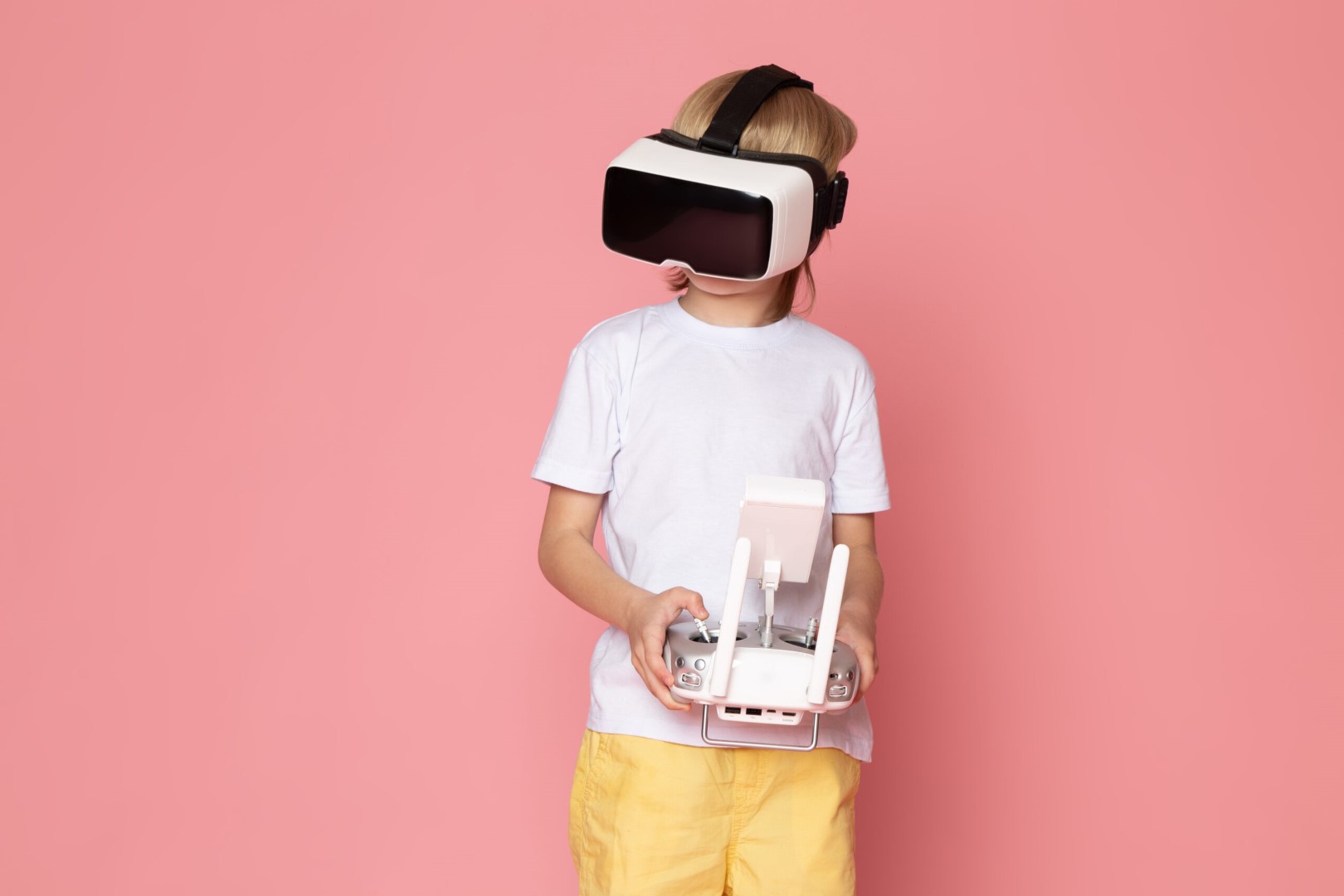 front view blonde kid playing vr white t shirt pink space 1 scaled (Custom)