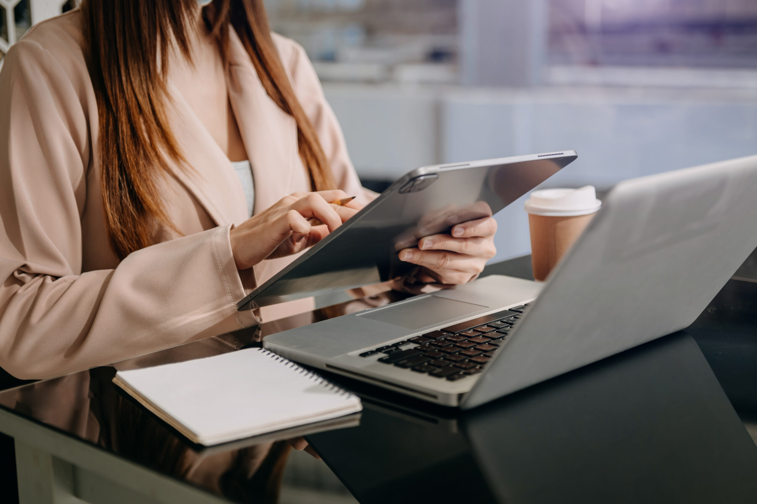 office woman with laptop, notepad, and notebook